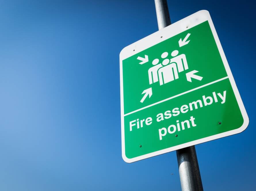 Green fire assembly point sign in Coventry
