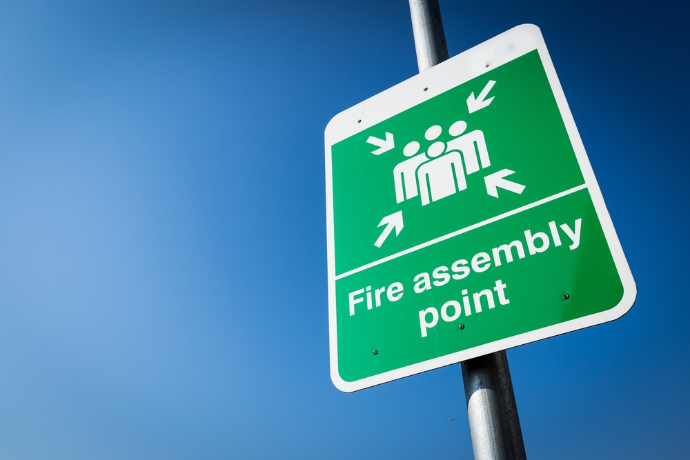 Green fire assembly point sign in Coventry